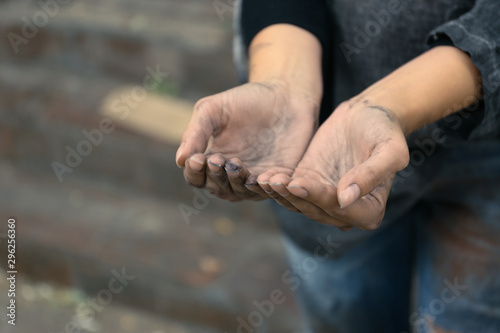 Poor homeless woman begging for help outdoors, closeup