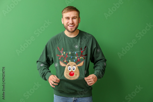 Young man in Christmas swea...