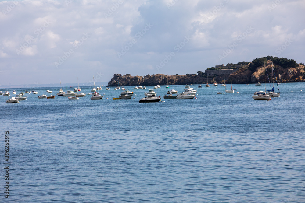 Fishing boats and yachts moored in the bay at high tide in Cancale, famous oysters production town. Brittany, France, Fishing boats and yachts moored in the bay at high tide in Cancale, famous oysters production town. Brittany, France,
