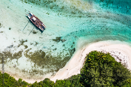 Top down view of a sailboat in the Muri lagoon in the Rarotonga in the Cooks island in Pacific