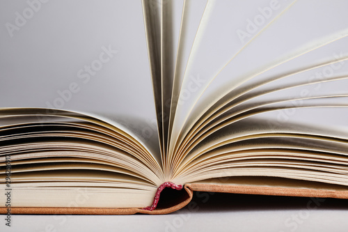 Closeup view of open book on light background