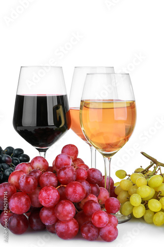 Glasses of different wine on white background