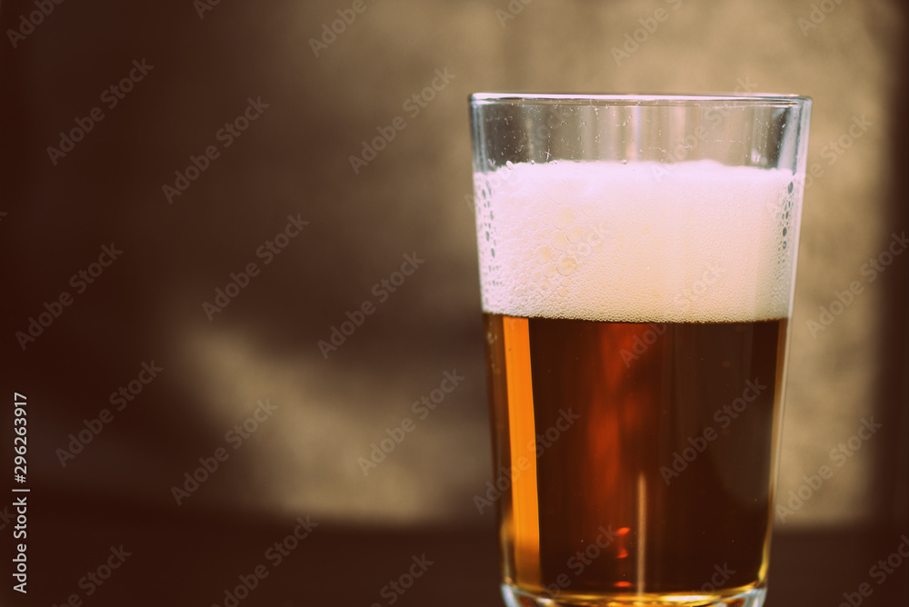 Glass with a light beer closeup in retro style Glass with a light beer closeup in retro style