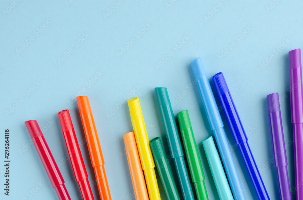 Colored felt tip pens composition on blue background. Colored felt tip pens composition on blue background.
