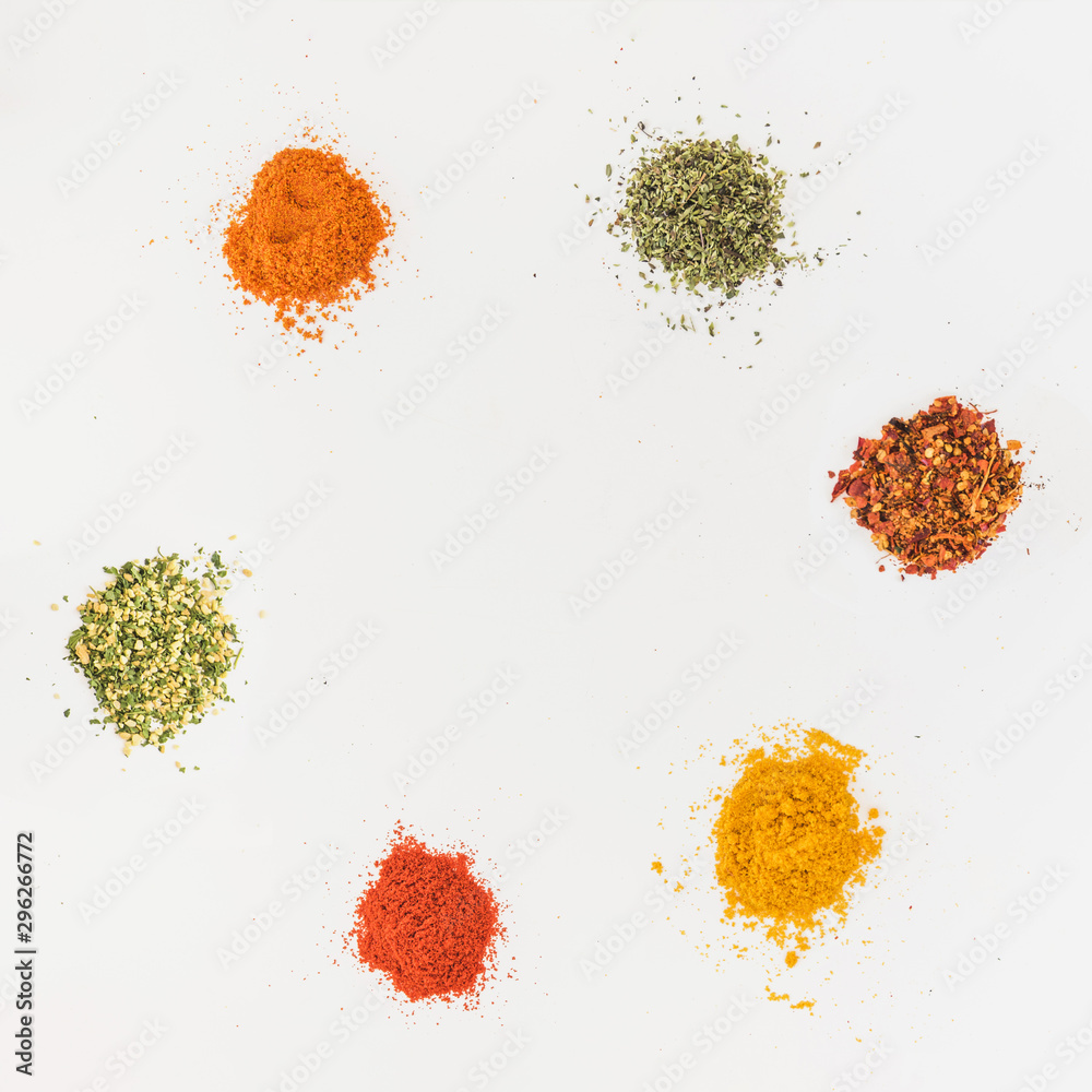 Various flavourings on white table - obrazy, fototapety, plakaty 