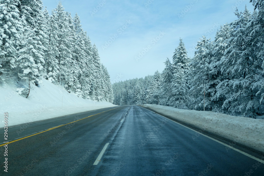 Wet road in winter condition, Montana, United States Wet road in winter condition, Montana, United States
