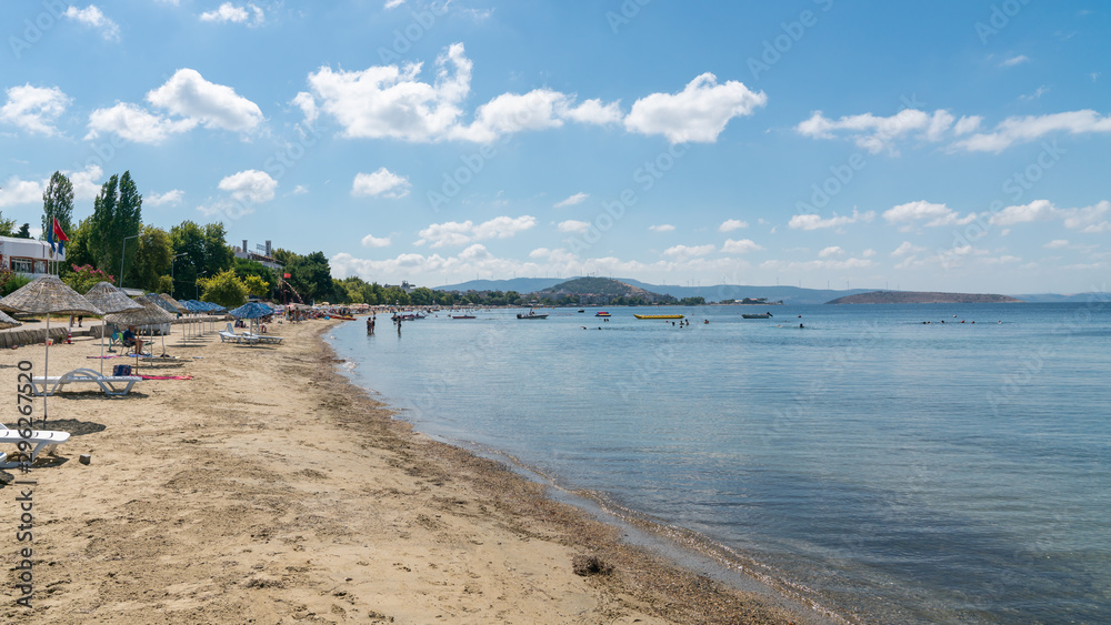 Beach of Erdek with people under the sun and swimming in the Marmara sea Beach of Erdek with people under the sun and swimming in the Marmara sea