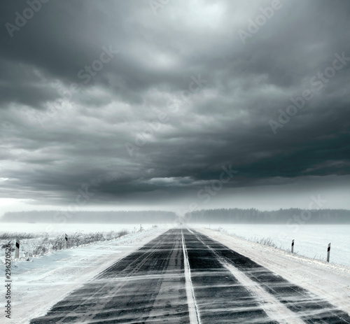 Stormy sky and snow road