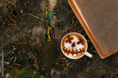 Coffee cup as jack o lantern pumpkin