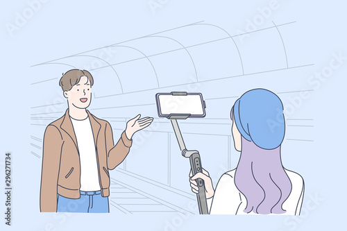 Blogging and vlogging, live video streaming, influencer opinion concept. Blogger, vlogger shooting video at underground station, create engaging content and social sharing. Simple flat vector