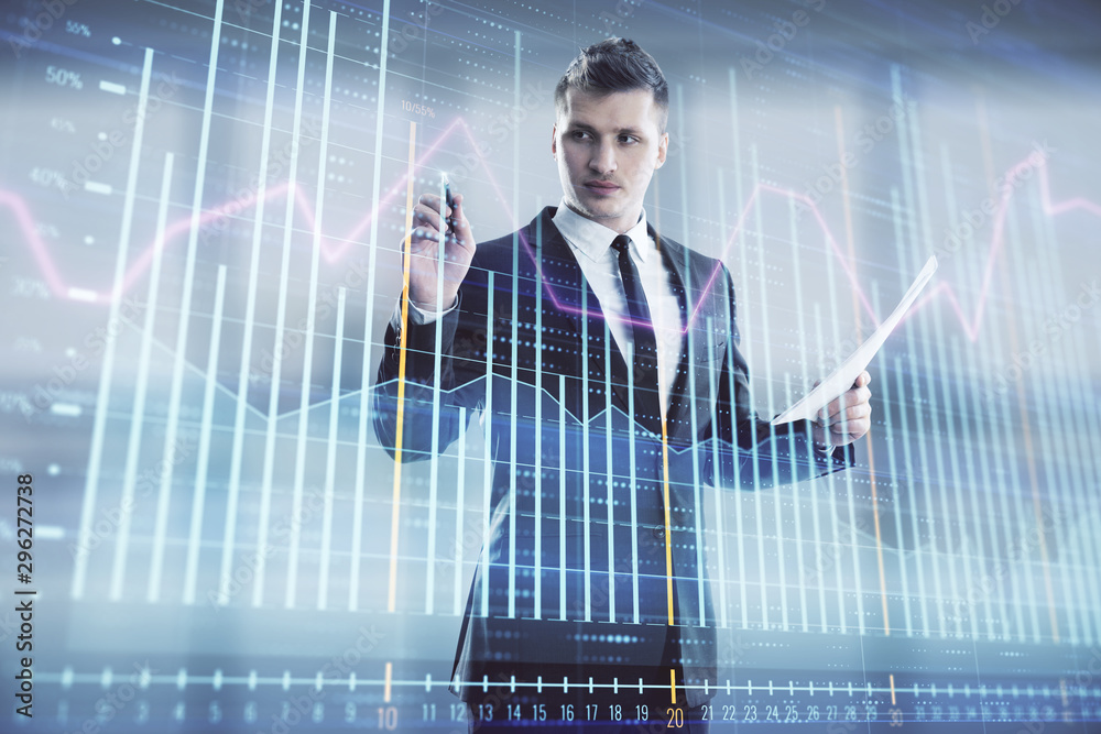 Businessman and forex graph hologram. Double exposure. Concept of financial education and analysis Businessman and forex graph hologram. Double exposure. Concept of financial education and analysis