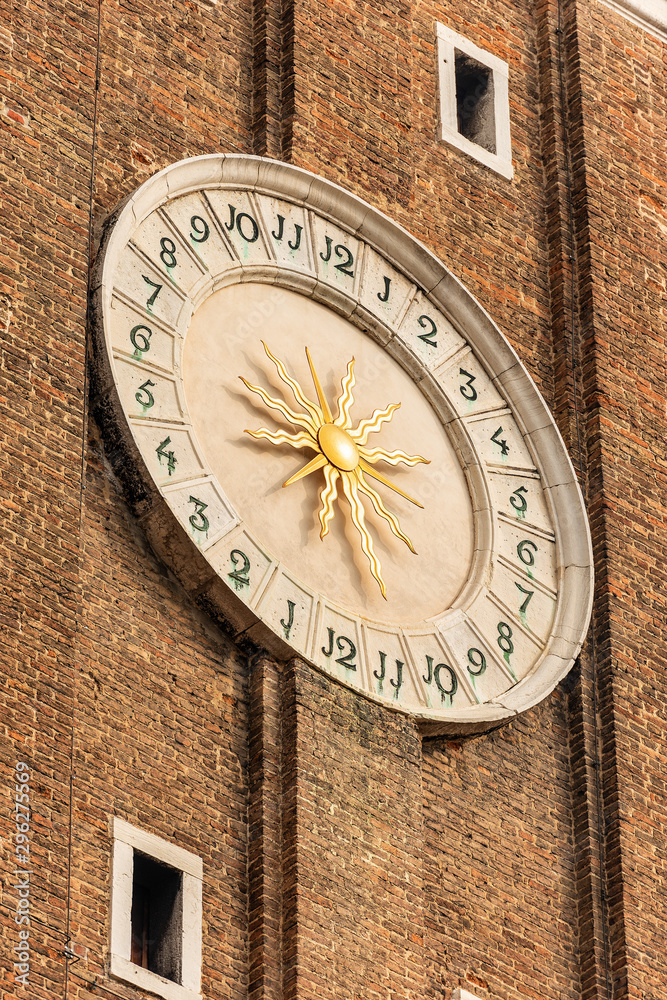 Venice, closeup of the bell tower of the Church of the Santi Apostoli (Holy Apostles), with the clock face, UNESCO world heritage site, Veneto, italy, Europe