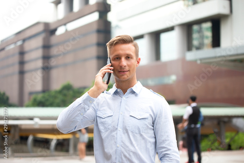 young man using mobile phone at outdoor