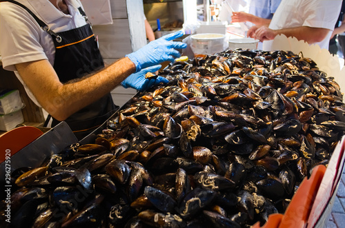 Canvas Print Heap of mussels in shells stuffed with rice and served with lemon