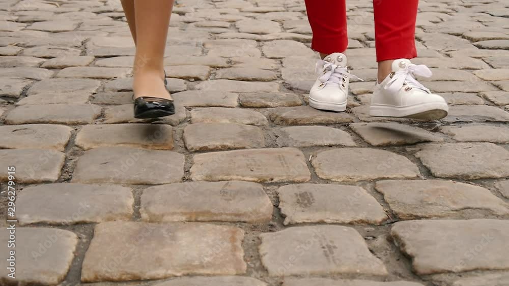 female legs are walking on asphalt female legs are walking on asphalt