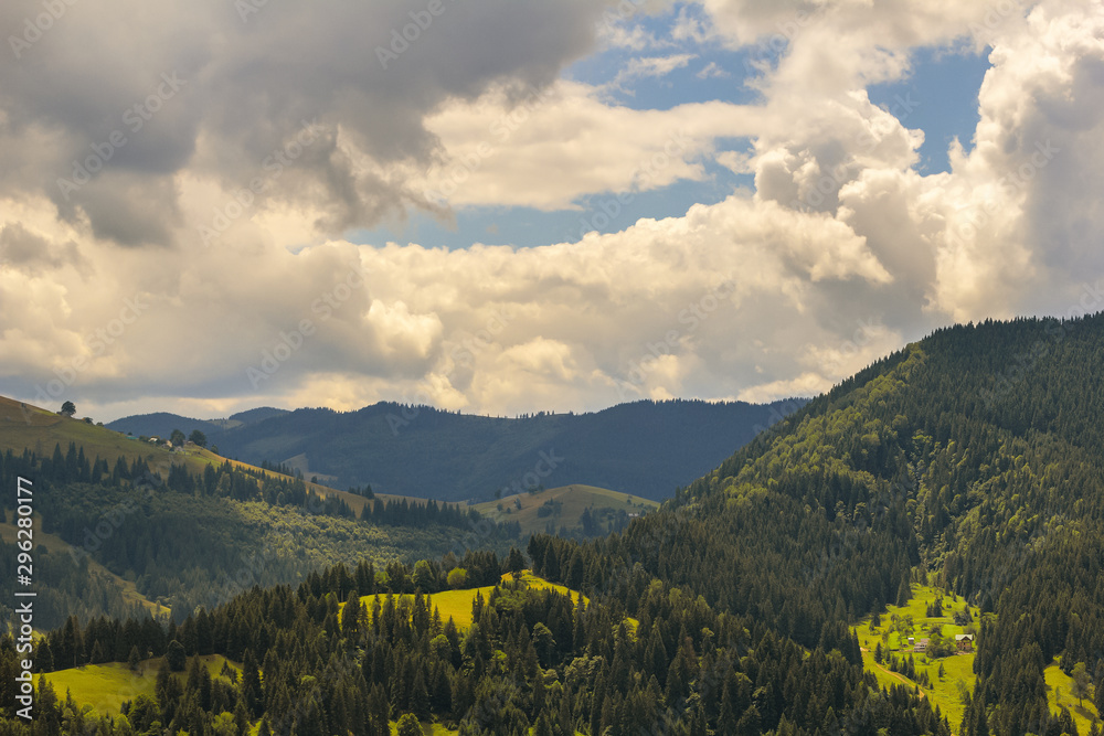 Summer landscape in the Carpathians. View of peaks covered with clouds and fog.