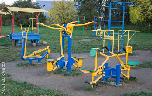 Public sports exercise machines for workout in a city park.