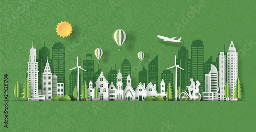 Paper art style of landscape with eco green city, happy couple riding together on bicycle, save the planet and energy concept, paper cut and craft style, flat-style vector illustration.