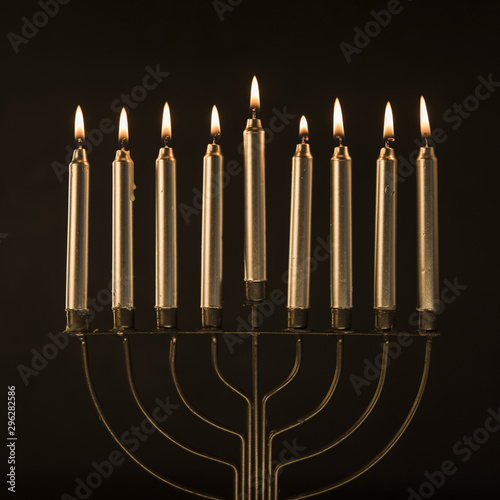 Elegant menorah with golden candles
