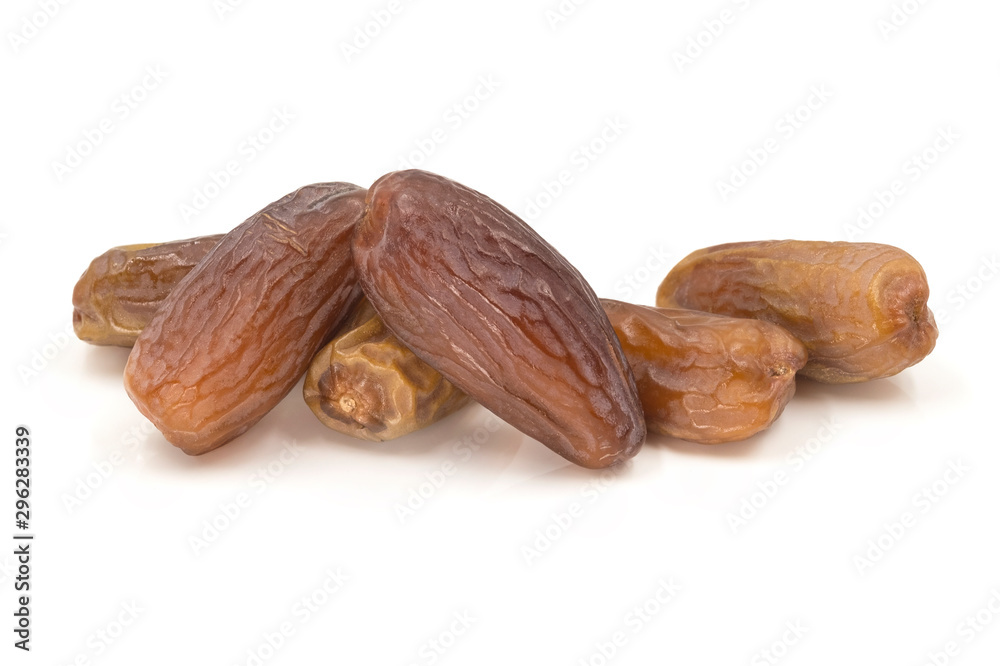 Close-up of dried dates palms fruit (Phoenix dactylifera), sweet taste isolated on white background. Close-up of dried dates palms fruit (Phoenix dactylifera), sweet taste isolated on white background.
