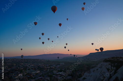 Sunrise panoramic view to Goreme city and flying balloons  Cappadocia  Turkey