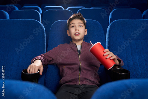 Canvas-taulu Strained boy watching horror movie in cinema