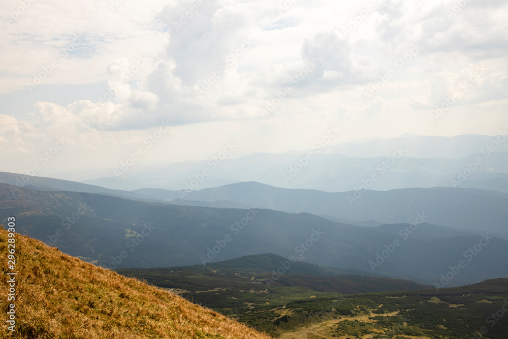 Beautiful landscape of mountains and forests against the blue sky. Travel concept.