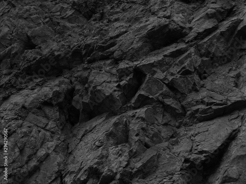    Black stone background. Mountain close-up. Fragment of the mountain.   Black rock texture. 