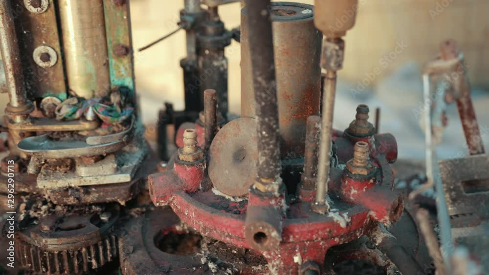 many old scrap, faulty, rusted mechanism, old machine from the factory, gears, which are a lot of rubber belts, slow motion, close up many old scrap, faulty, rusted mechanism, old machine from the factory, gears, which are a lot of rubber belts, slow motion, close up