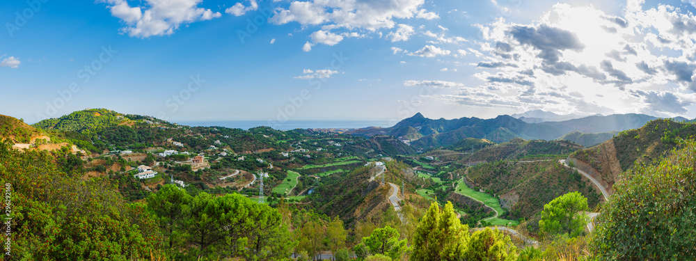 Mountain landscape on a sunny day. Panoramic view from the serpentines of the highway A-397 Ronda - Malaga. Spain, Andalusia