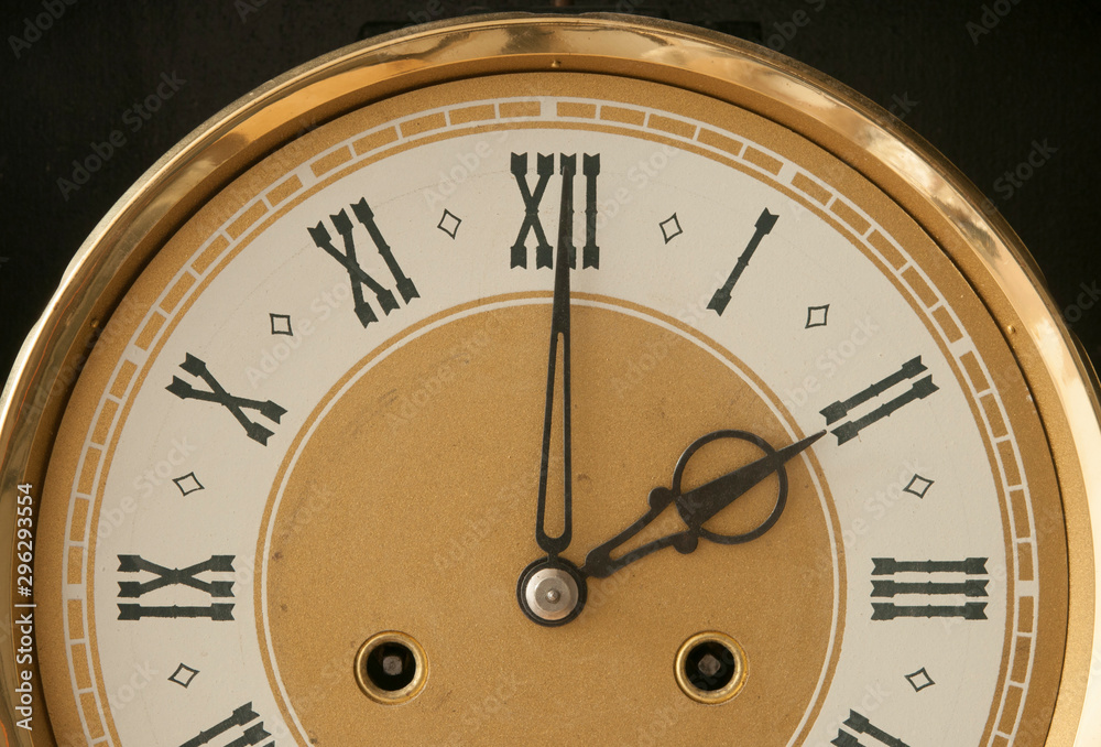 Close up old antique classic clock. Retro style. Vintage background. Close up old antique classic clock. Retro style. Vintage background.