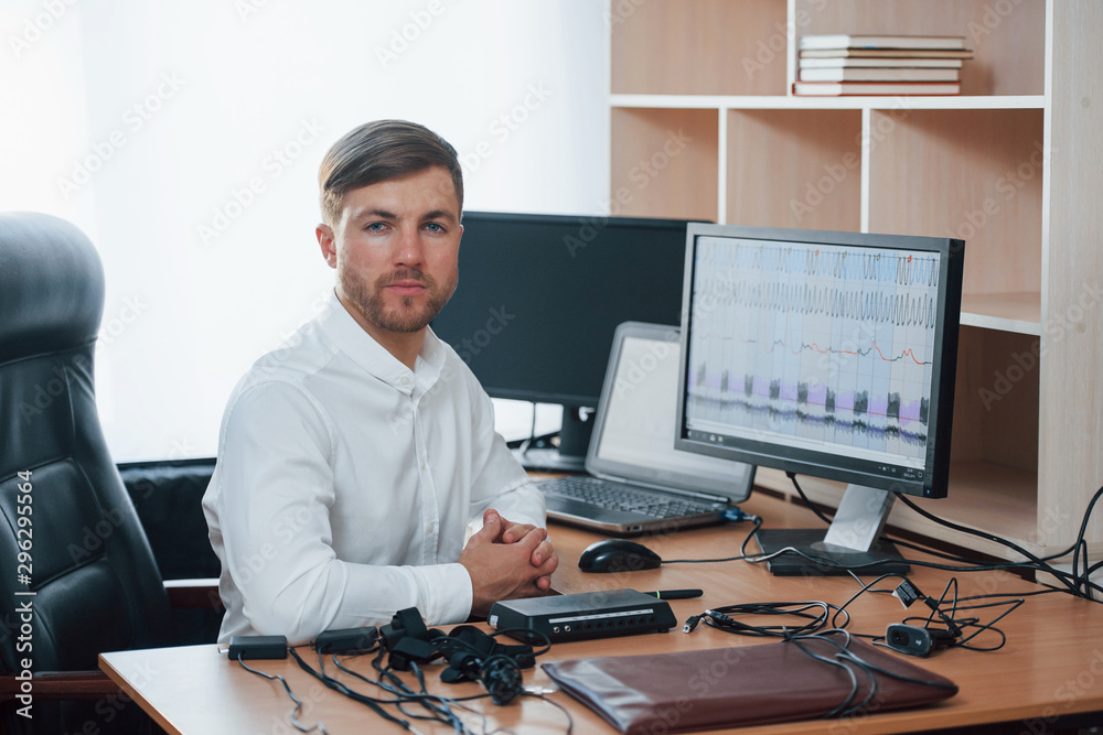 In the workplace. Polygraph examiner works with his lie detector's equipment In the workplace. Polygraph examiner works with his lie detector's equipment