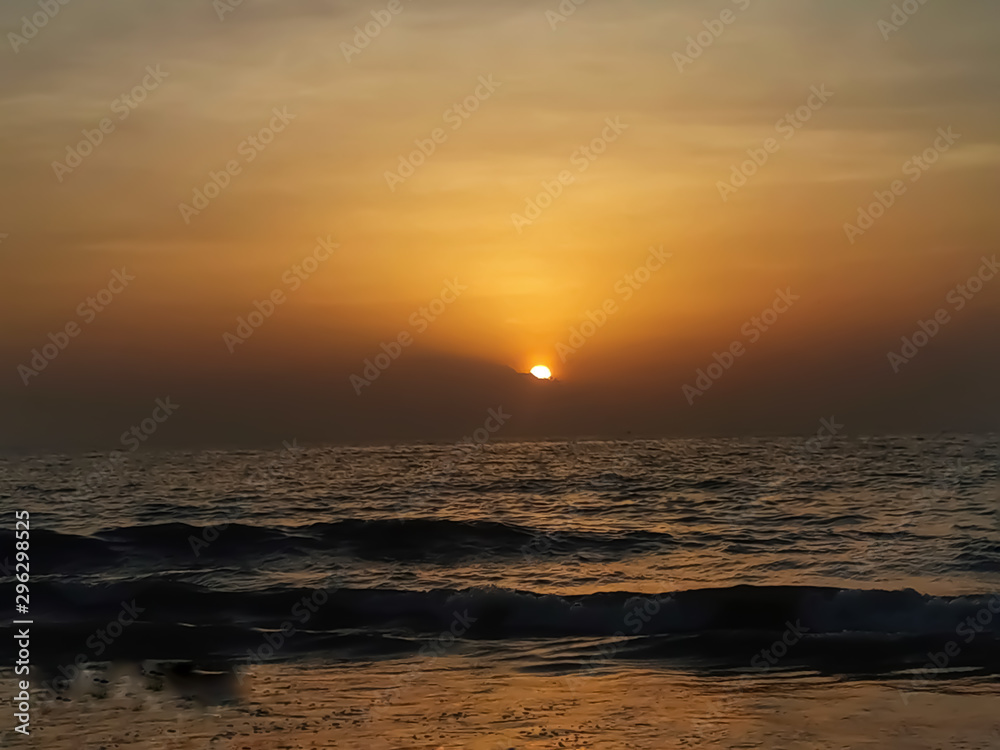 Beautiful sunset or sunrise view of sea with waves.