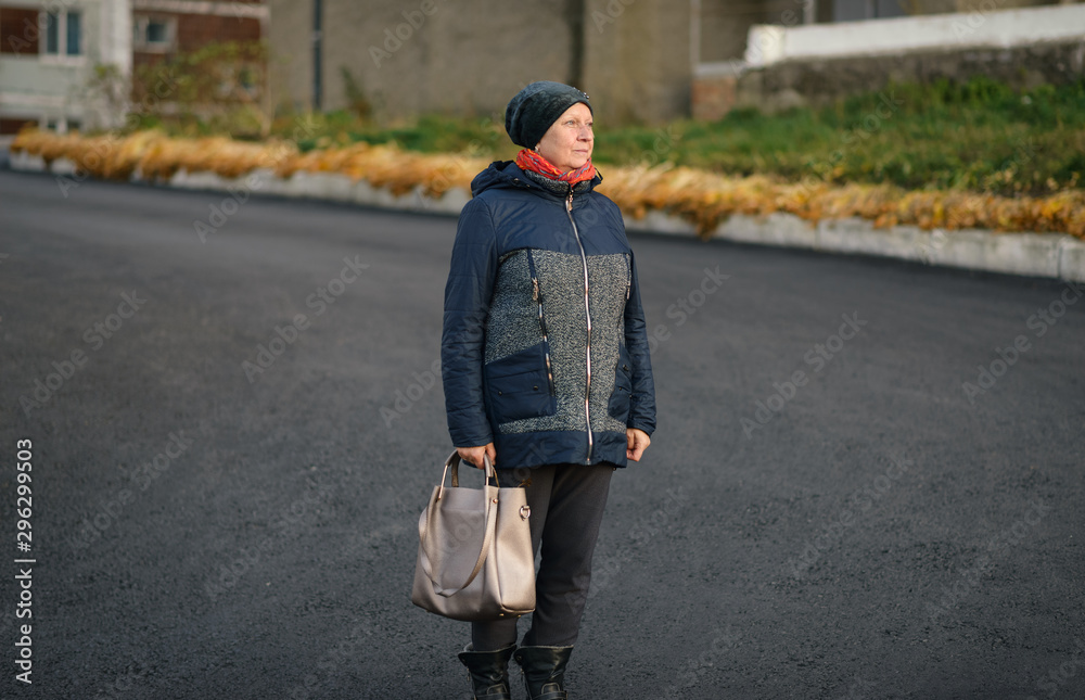Portrait of beautiful aged woman in the street. Portrait of beautiful aged woman in the street.