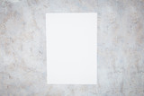 Blank paper sheets for brochure on worn white background. Mock up.