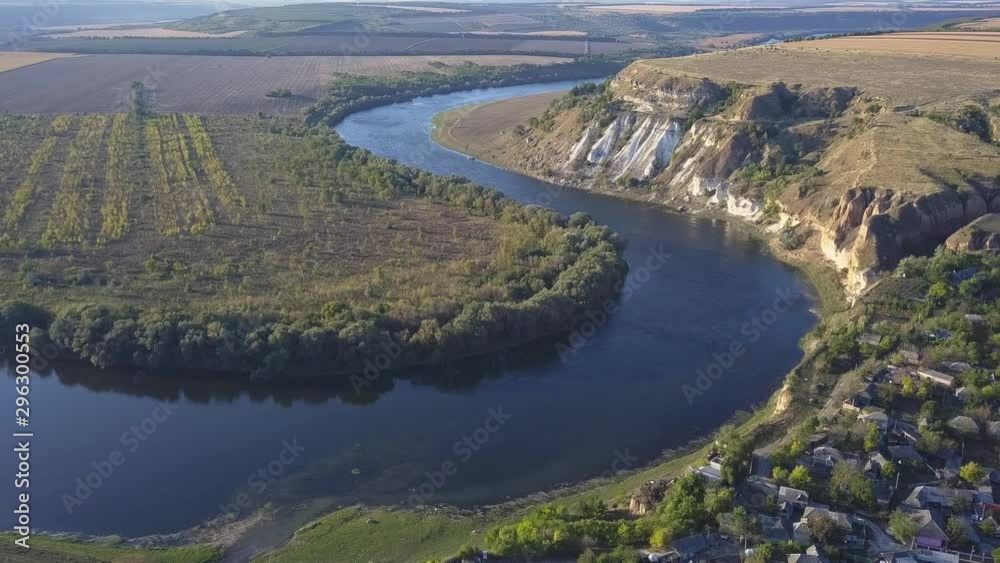 Flight over the river and small village in autumn. Moldova republic of. Molovata village. River Dniester. Flight over the river and small village in autumn. Moldova republic of. Molovata village. River Dniester.