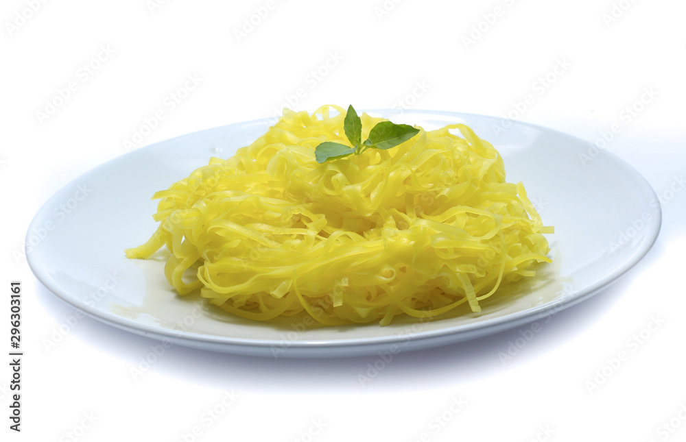 yellow noodles on dish isolated on white background