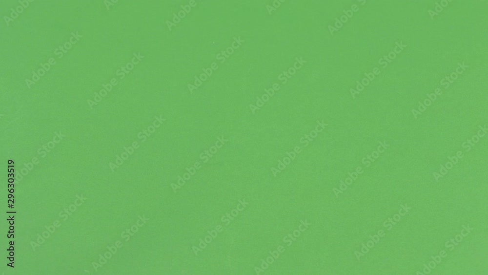 Green screen shot of a whit man's hand picking up an apple Green screen shot of a whit man's hand picking up an apple