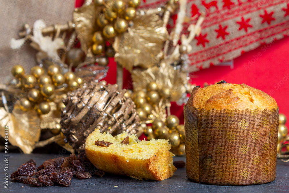 Christmas Panettone with slice and Christmas setting. Typical Italian Christmas holiday cake