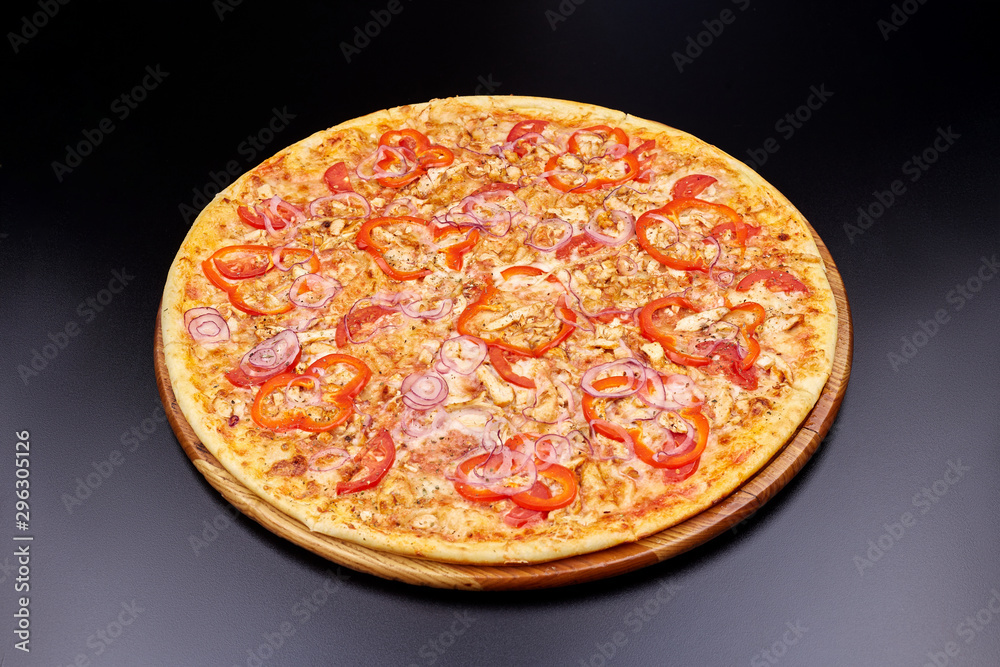 Pizza Margherita on darken background in an italian restaurant. Pizza Margherita on darken background in an italian restaurant.