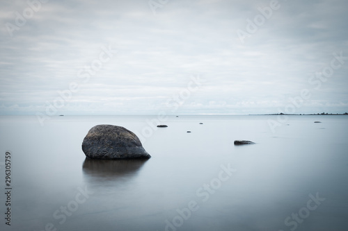 Long exposure of stones at lake Concept of Zen