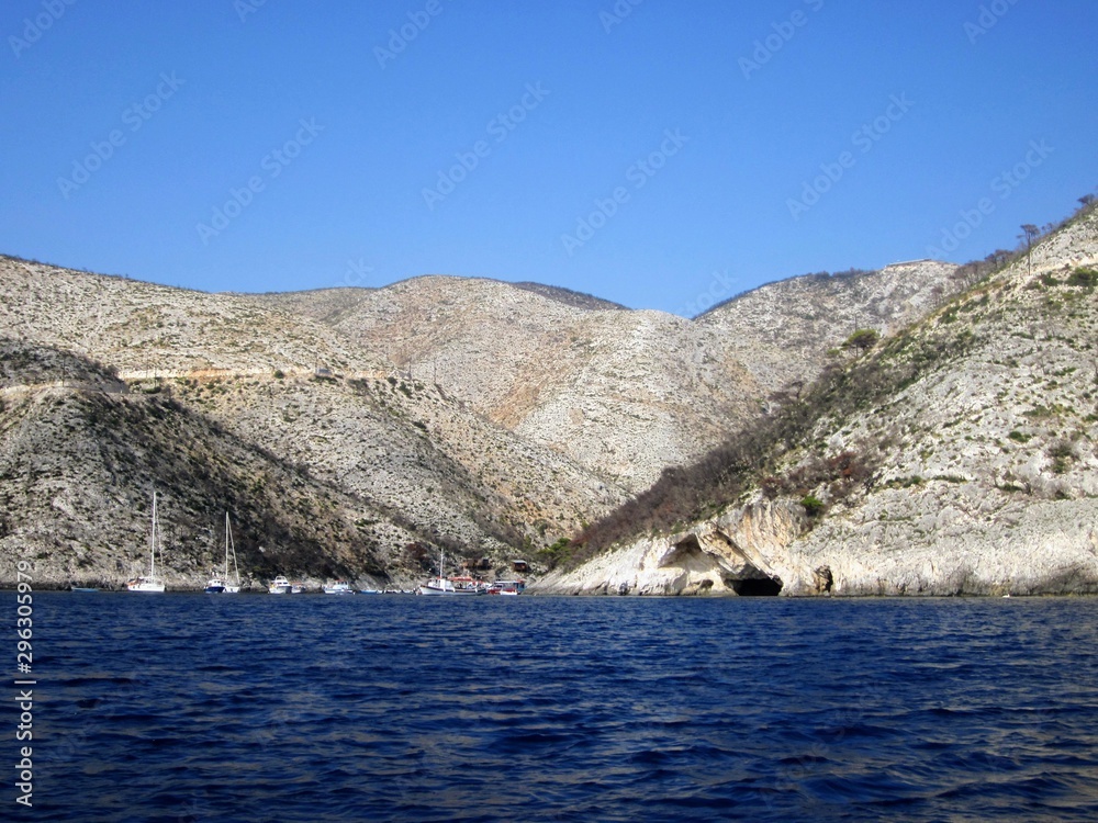 Porto Vromi on Zakynthos island. Colourful fishing boats, yachts and turquoise water in the blue lagoon of Porto Vromi, Greece