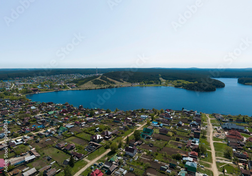 Sysert city, Sysert pond and Bessonov mountain. Russia. Aerial, summer, sunny
