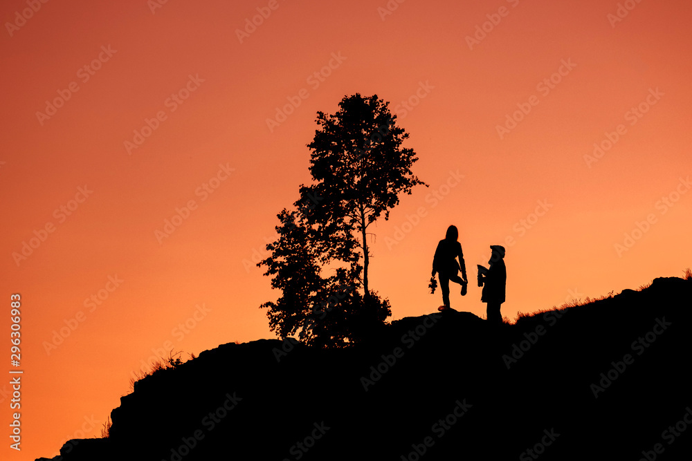 silhouettes two people on sorrow the young man and girl