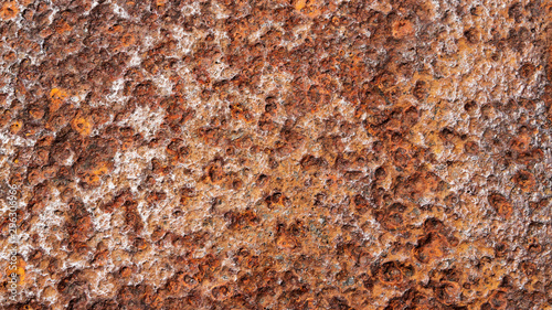 close up background texture of weathered, rusty, and pitted metal