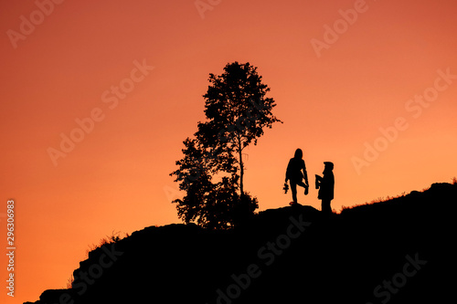 silhouettes two people on sorrow the young man and girl