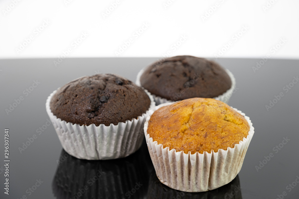 Delicious of banana and chocolate chip cupcake isolated on black background Delicious of banana and chocolate chip cupcake isolated on black background