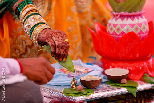 A couple doing havan or puja at home as per hindu tradition