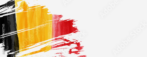 Banner with grunge painted flag of Belgium photo