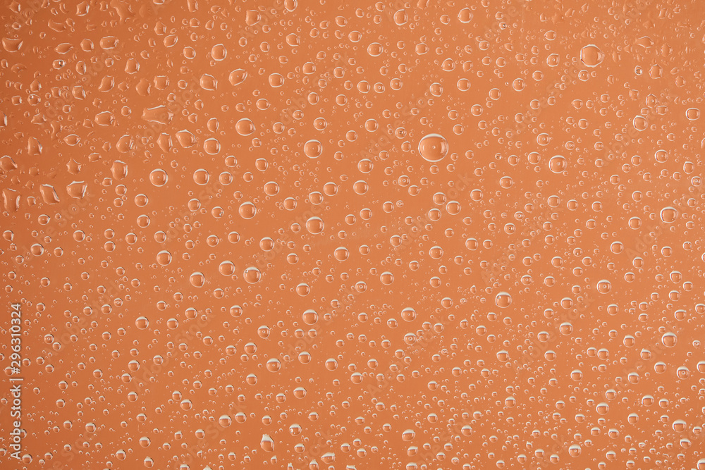 clear transparent water drops on beige background clear transparent water drops on beige background